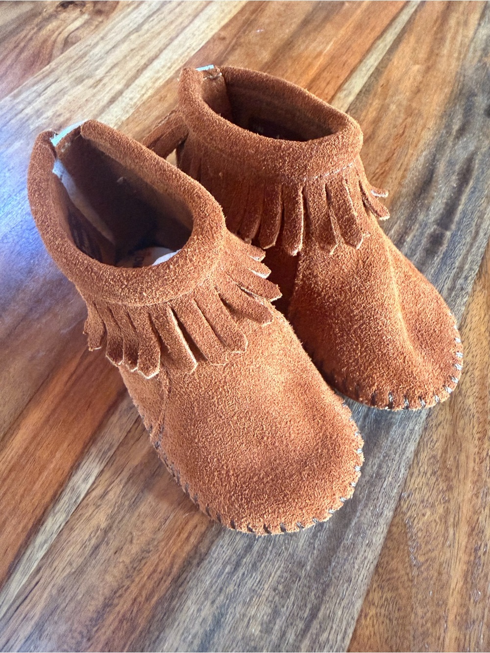 Minnetonka Kids Suede Fringe Moccasins in Burnt Orange